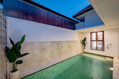 an indoor pool in a house with a ceiling at Emerald Pura 2BR Villa - Private & Peaceful in Ungasan