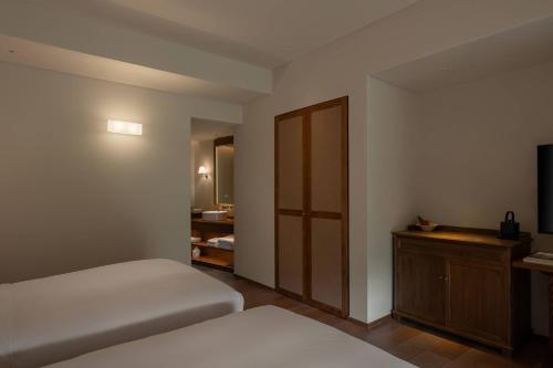 Una cama o camas en una habitación de Huanghsan SU House