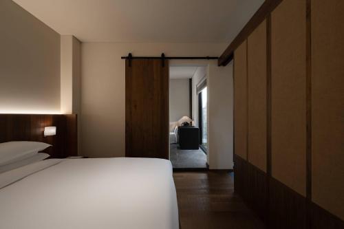 Una cama o camas en una habitación de Huanghsan SU House