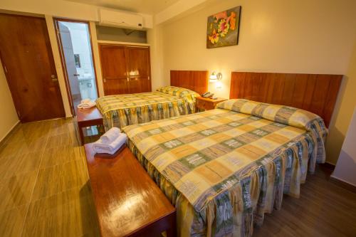 Cama o camas de una habitación en Amazonia Siu Hostal