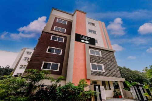 a building with a sign on the side of it at Super Collection O Atlas DLF Formerly Hillside in Kondapur