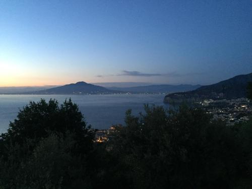 a view of a large body of water at dusk at Villa Li Schisani in Sorrento