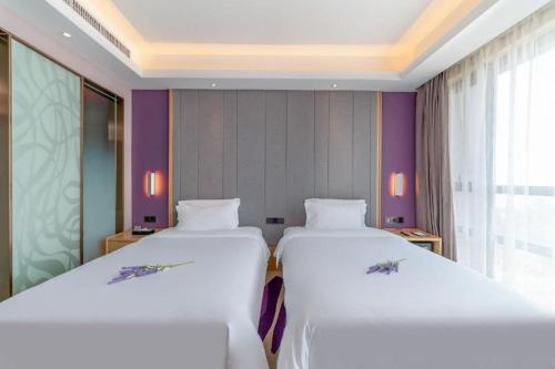 Postel nebo postele na pokoji v ubytování Lavande Hotel·Sihui Dawang