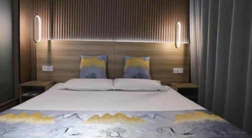 Katil atau katil-katil dalam bilik di Shell Zaozhuang Taierzhuang Ancient City East Gate Hotel