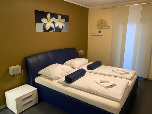 Ένα ή περισσότερα κρεβάτια σε δωμάτιο στο Familienhaus mit Garten, Terrasse & Grill