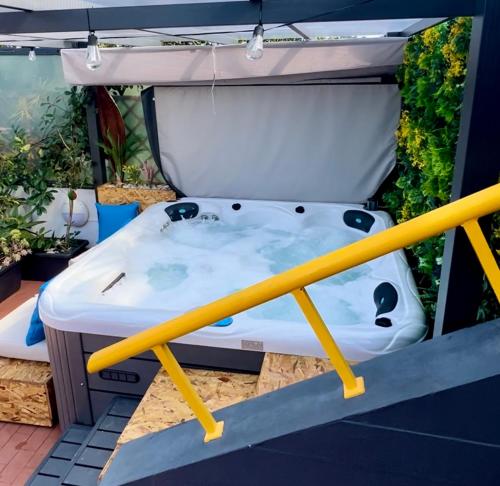 a bed in the back of a truck at O CANTINHO DA RIA - JACUZZI with water at 35 degrees and POOL in Torreira