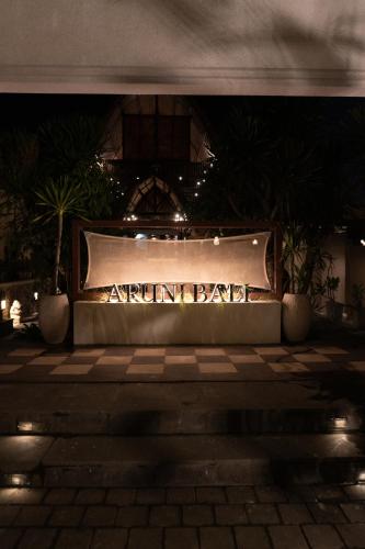 a sign that reads artificial park at night at Aruni Bali Jimbaran Boutique Villa in Jimbaran