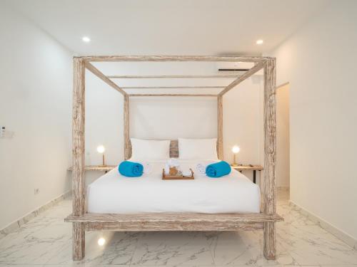 Кровать или кровати в номере Ama Wela Living Labuan Bajo