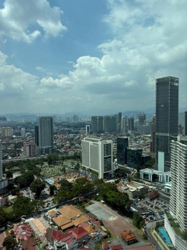 an aerial view of a city with tall buildings at Vortex klcc lotus in Kuala Lumpur