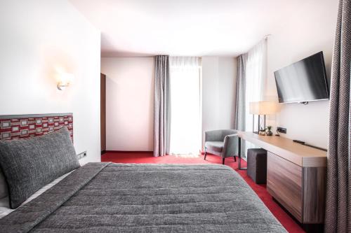Cama o camas de una habitación en Viešbutis Simpatija