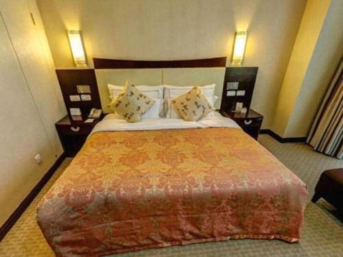 Postel nebo postele na pokoji v ubytování Beijing Jinjiang Fuyuan Hotel