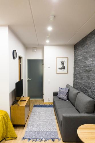 Μια τηλεόραση ή/και κέντρο ψυχαγωγίας στο Levin Orion Apartments Visit Levi