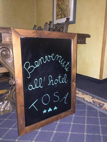a chalkboard sign that says bannanas all motel kosa at Hotel Tosa in Madonna di Campiglio