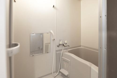 a bathroom with a sink and a bath tub at Toritonear402-with parking space K-bed1 in Sapporo