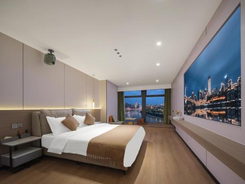 a bedroom with a large bed and a large window at Ouchen International High altitude Cloud River View Hotel Chongqing Guanyinqiao Beibin 1st Road in Chongqing