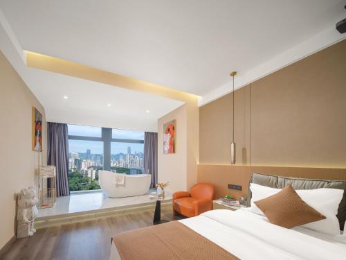 a bedroom with a large bed and a large window at Ouchen International High altitude Cloud River View Hotel Chongqing Guanyinqiao Beibin 1st Road in Chongqing