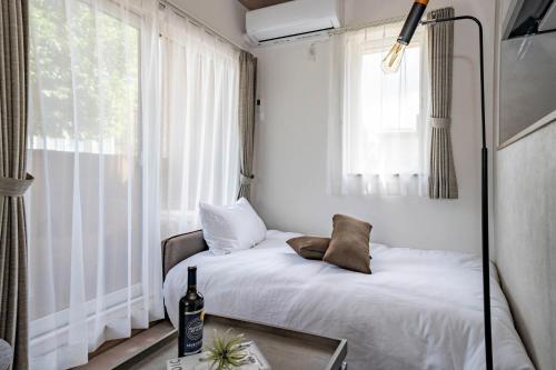 a bed in a room with a window at Mks 101 in Wada