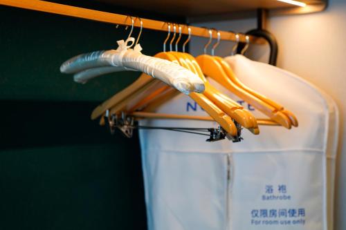 a hanger with a bunch of utensils on it at Novotel Kunshan East in Kunshan