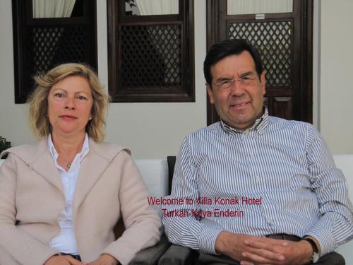 a man and a woman sitting next to each other at Villa Konak Hotel in Kusadası