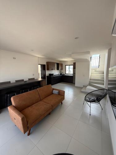 a large living room with a couch and a table at Take A Break in El Suazal