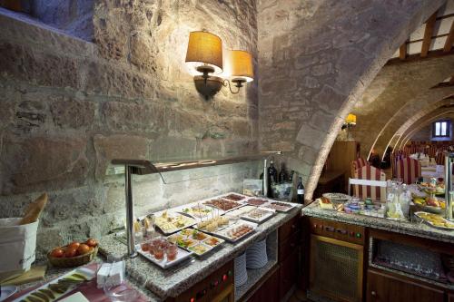 a buffet line with many different types of food at Parador de Cardona in Cardona