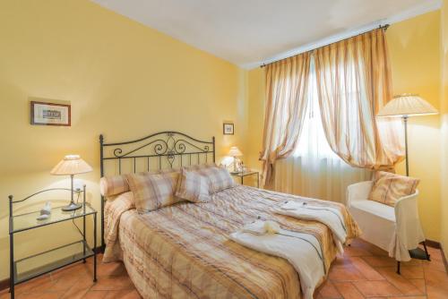 Un pat sau paturi într-o cameră la Agriturismo La Torricella
