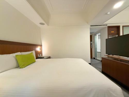 Cama o camas de una habitación en Hub Hotel Kaohsiung Cisian Branch