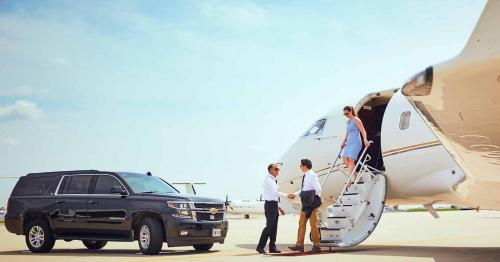 a group of people getting off of an airplane at Airport Transport Service Raleigh NC in Morrisville