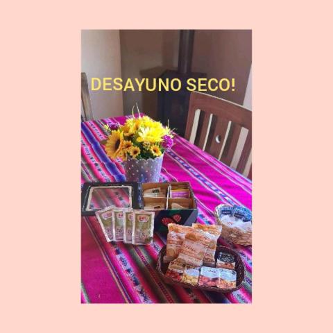 a table with some food and flowers on it at La Comarca in Uspallata