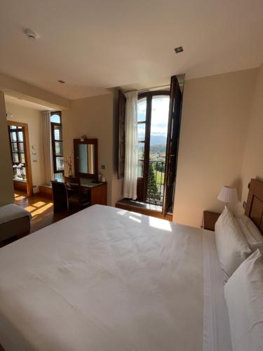 Giường trong phòng chung tại Hotel Villadesella