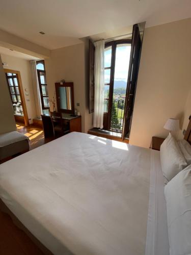 Giường trong phòng chung tại Hotel Villadesella