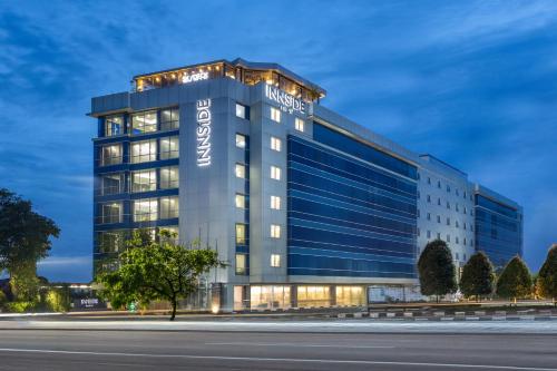 an office building with a sign on it at INNSiDE by Meliá Yogyakarta in Yogyakarta