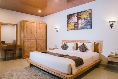Postel nebo postele na pokoji v ubytování Grand Kesambi Resort and Villas Seminyak