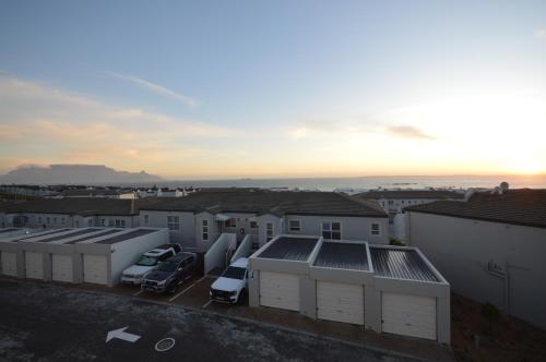 a view from the roof of a parking lot at Dolphin Ridge 2 Bedroom with Balcony and Ocean Views in Cape Town