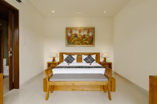 Postel nebo postele na pokoji v ubytování Yanyan Resort Ubud