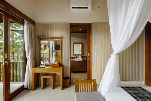 Postel nebo postele na pokoji v ubytování Yanyan Resort Ubud