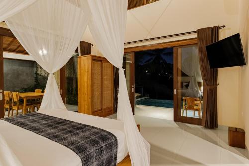 TV a/nebo společenská místnost v ubytování Yanyan Resort Ubud