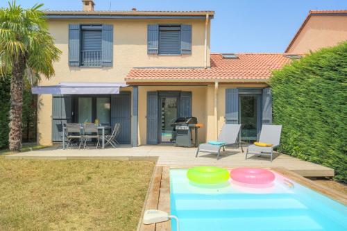 a house with a swimming pool in front of a house at Sunny House - Villa 4 chambres - Saint Genis Les Ollières in Saint-Genis-les-Ollières