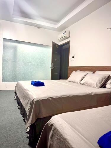 Postel nebo postele na pokoji v ubytování Hotel & Massage HƯƠNG GIANG 3