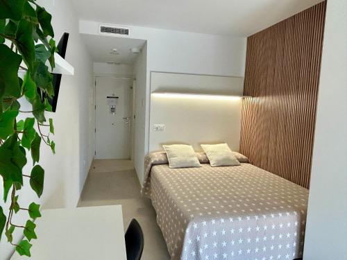 Postel nebo postele na pokoji v ubytování STUDIO Palomar - PalomarGroup