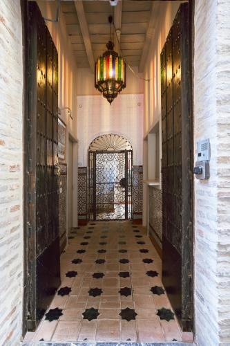 an entrance to a building with a chandelier at Hotel Boutique Casas de Santa Cruz in Seville