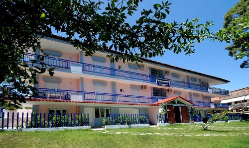 a building with balconies on the side of it at Thalassenia Studios & Apartments 3 in Hanioti