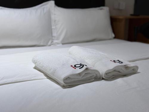 Ένα ή περισσότερα κρεβάτια σε δωμάτιο στο I Go Hotel USJ