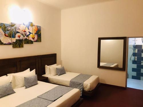 Postel nebo postele na pokoji v ubytování Hotel FernCliff