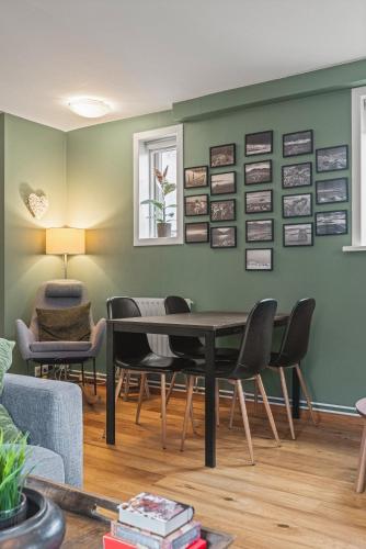 a dining room with a table and chairs at Cosy Haven Apartment in Reykjavík