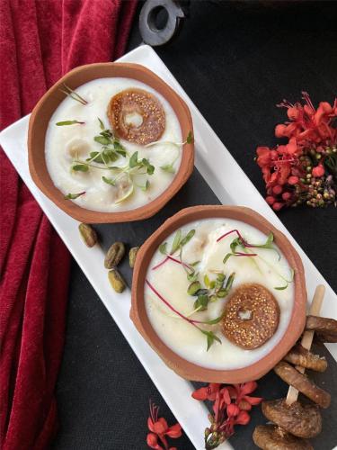 two bowls of food on a white plate at Radisson Blu Gorakhpur in Gorakhpur
