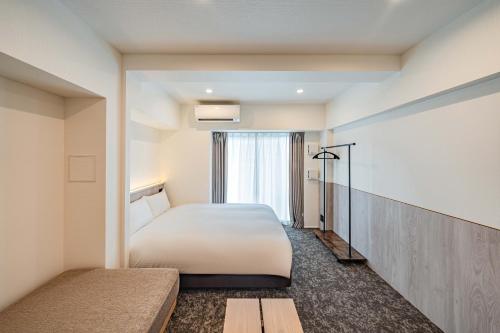 Postel nebo postele na pokoji v ubytování Apartment Hotel 11 Asakusa 2