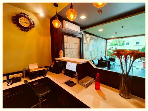 an office with a desk with a computer and a chair at Hotel Pearl Royal # Crown Puri Near Jagannath Temple & Puri Beach # Fully Air Conditioning #Restaurant -Free Wi-Fi # Parking -Top Rated Hotel In Puri in Puri