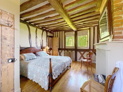 Postel nebo postele na pokoji v ubytování Le manoir de Vieux Port