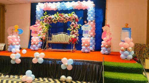 a birthday party with a balloon decoration on a table at HOTEL AMORA - Rajnandgaon in Rāj Nāndgaon